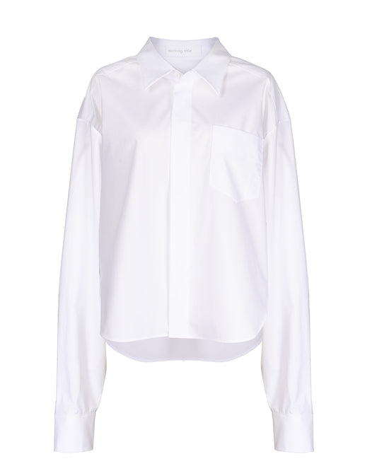 Elegant oversized GOTS-certified cotton shirt with a classic collar and subtle striped pattern, ideal for both casual and formal wear.