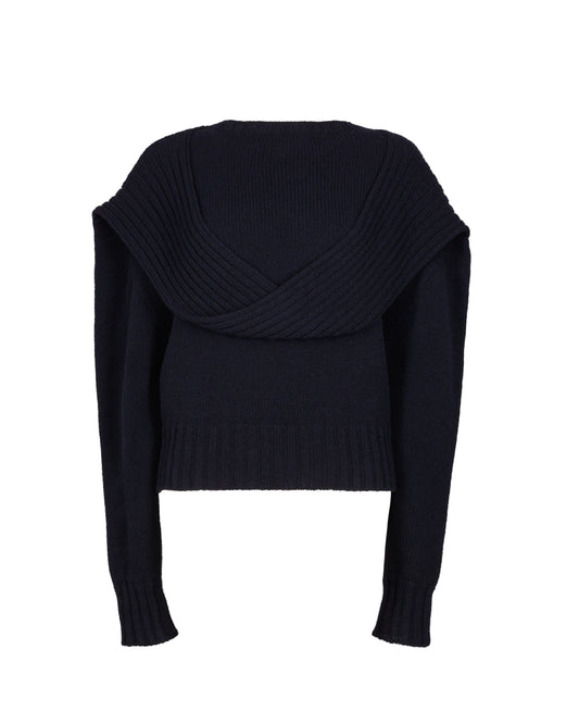 Chunky knit jumper featuring a distinctive loop detail at the draped neckline, with fitted sleeves for a contemporary and stylish look.