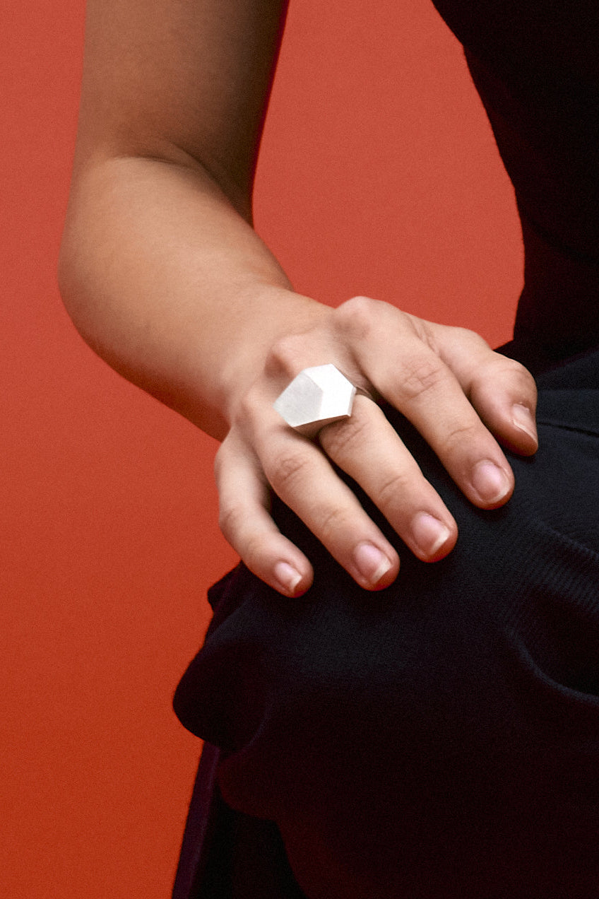 Architectural signet ring crafted from solid 925 sterling silver with sculptural geometric silhouette.