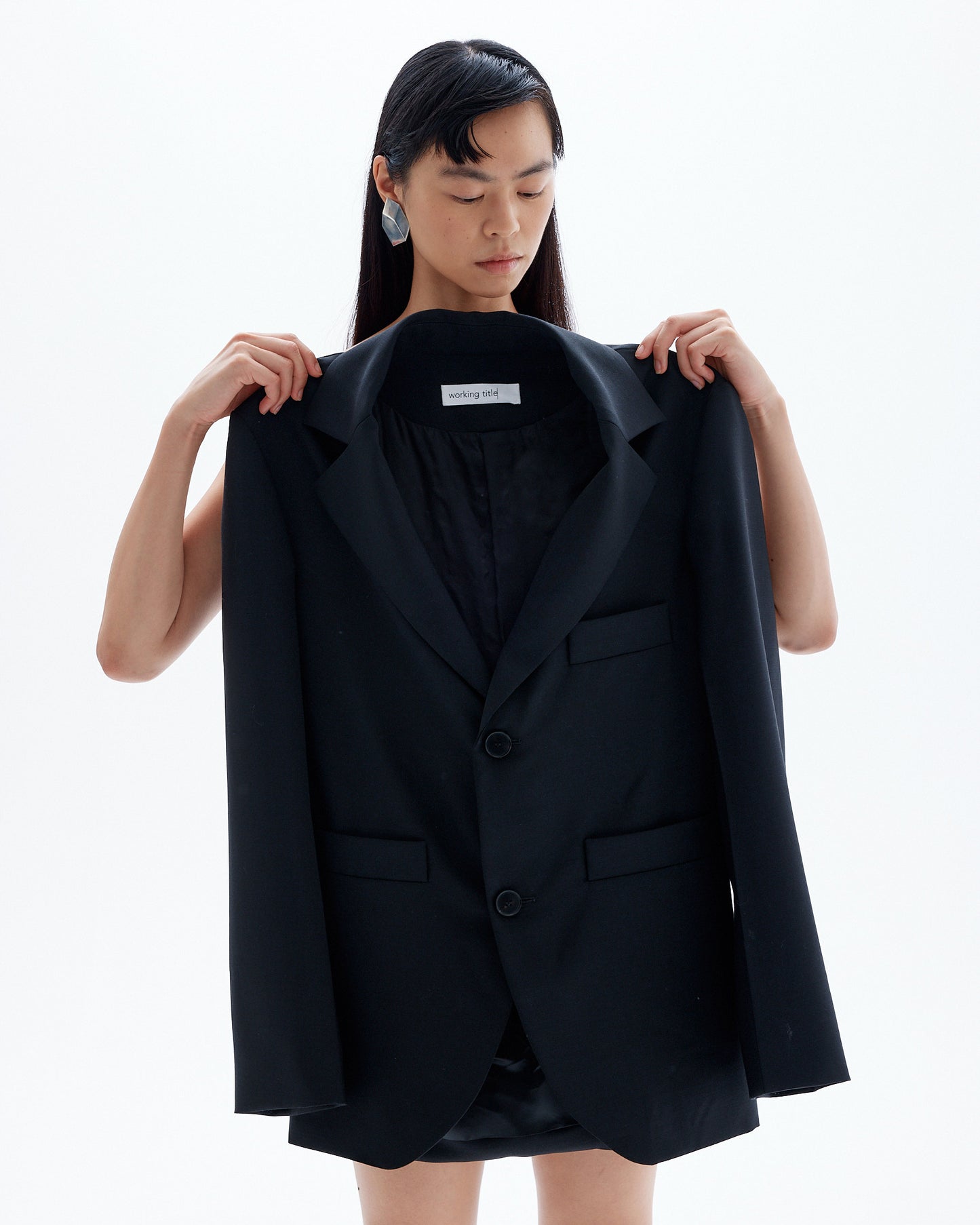 Cara holding Black Unisex Blazer as Gift Card