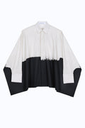 Oversized architecture-inspired kimono-cotton shirt with abstract brushstroke print and sculptural wide sleeves.