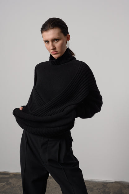 Elegant black chunky loop turtleneck sweater with a unique loop detail and snug ribbed cuffs for a sophisticated, cozy winter look